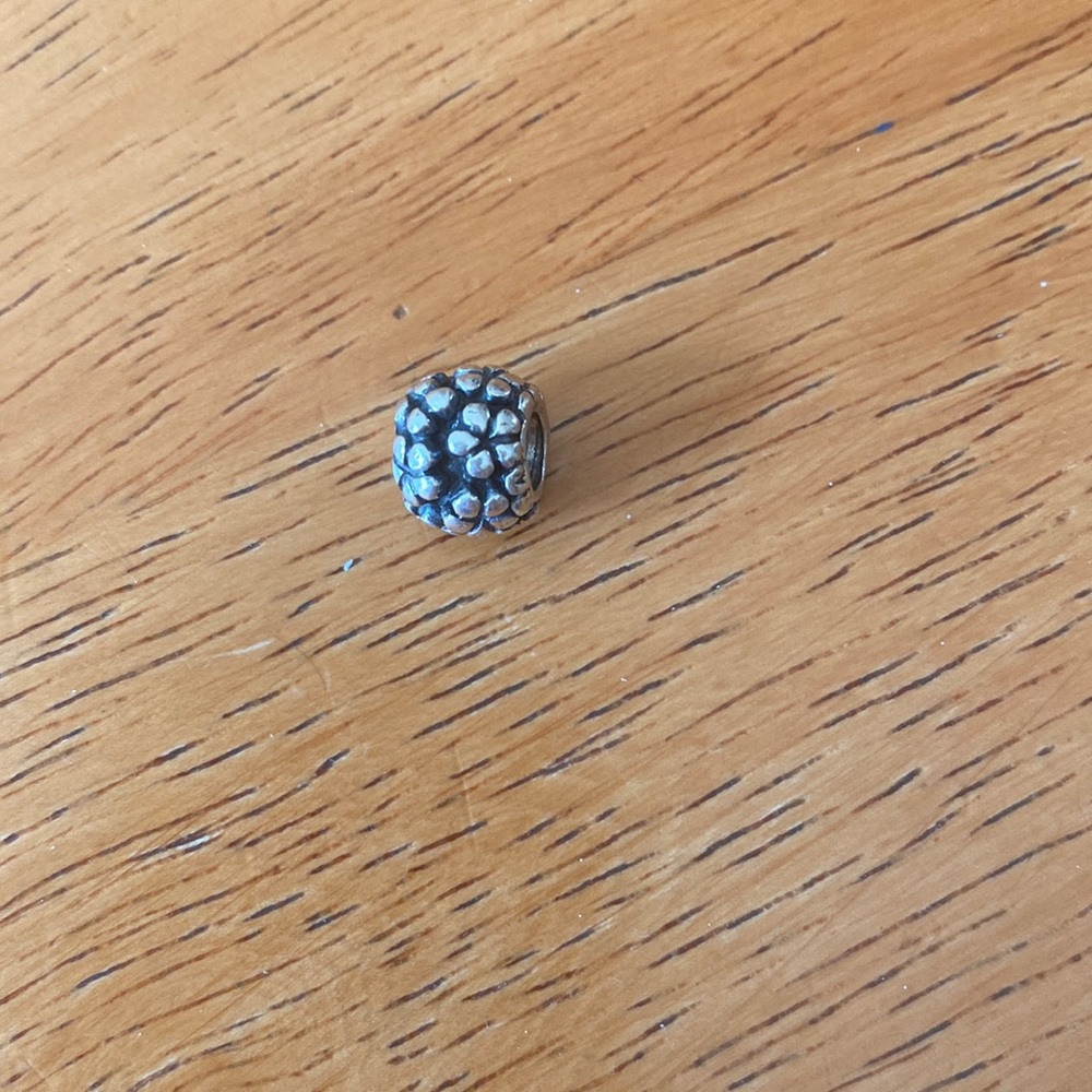 Silver flower charm